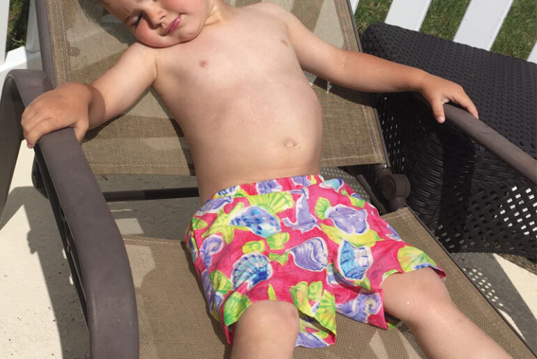 kid getting sun tanning