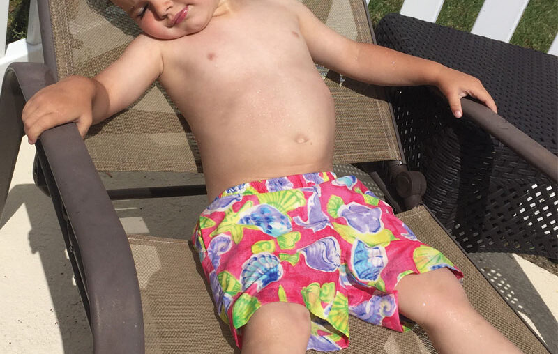 kid getting sun tanning