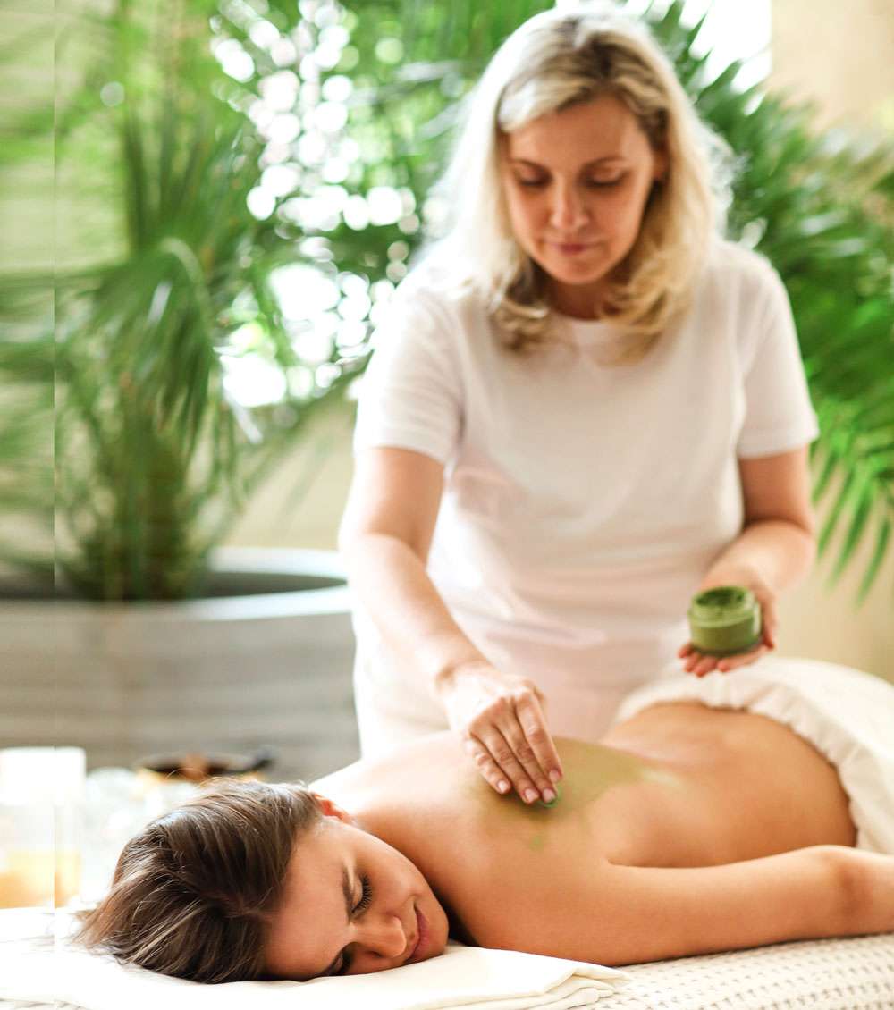 Therapist providing Ayurvedic Massage and Panchakarma treatment